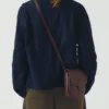 Borsa con linguetta semicircolare in pelle di Kate Sheridan Borsa con linguetta semicircolare in pelle di Kate Sheridan