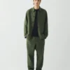 Pantaloni elasticizzati in misto cotone e lino a righe sovratinte Pantaloni elasticizzati in misto cotone e lino a righe sovratinte