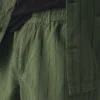 Pantaloni elasticizzati in misto cotone e lino a righe sovratinte Pantaloni elasticizzati in misto cotone e lino a righe sovratinte